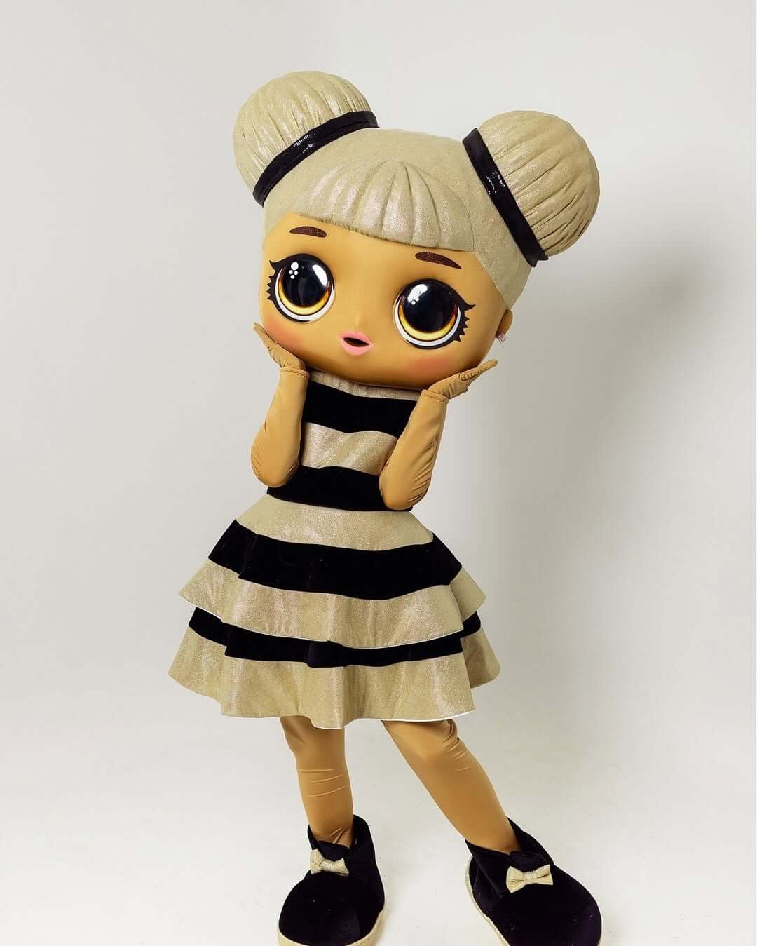 LOL Doll mascot in striped dress posing at a kids' party in Los Angeles – mascot rental service.