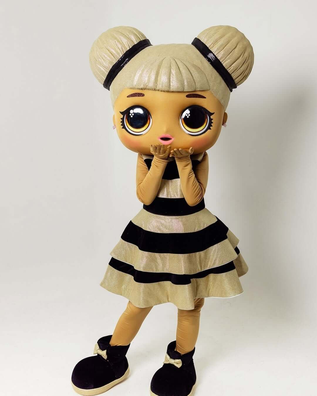 LOL Surprise Doll mascot in striped dress blowing kisses – popular party character in Espoo, Uusimaa, Finland.